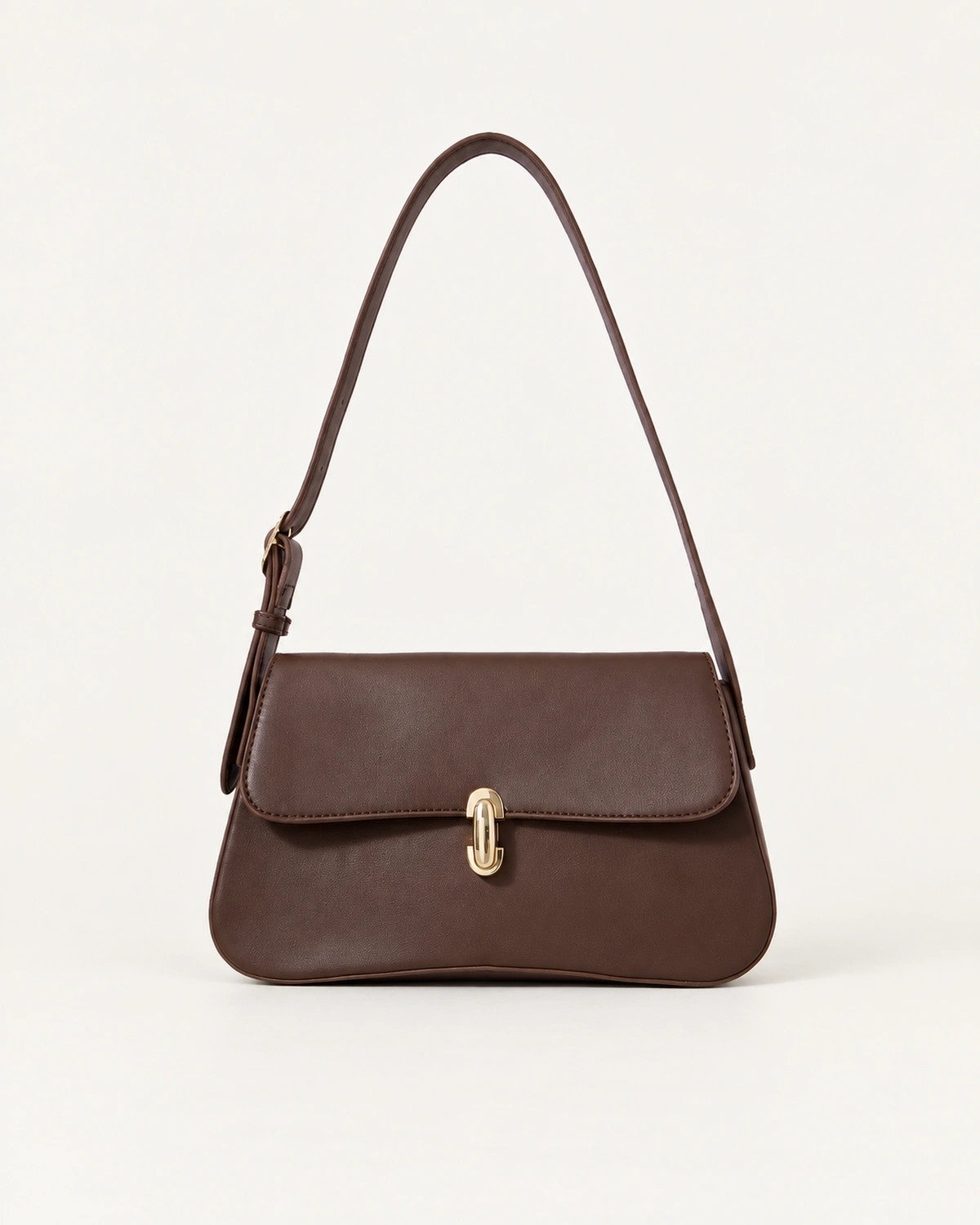Bolsa tiracolo Café em couro liso em vista frontal no estúdio mineral.