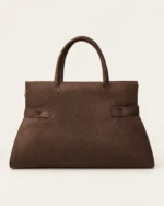 Bolsa tote estruturada marrom café com vista de perfil destacando profundidade e base reforçada